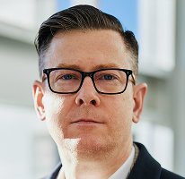 暗号資産取引会社のエグゼクティブを務めるCEO、Alexander Hughesのポートレート